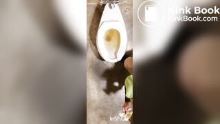 Two women shitting in public toilet