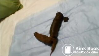 Asian girl pooping on hotel bed