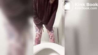 Cute girl shitting again in toilet