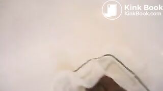 Relieving herself in her white undies..