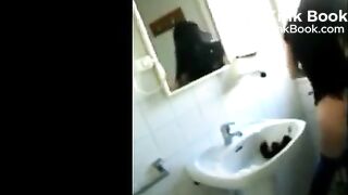 Woman shitting in the sink