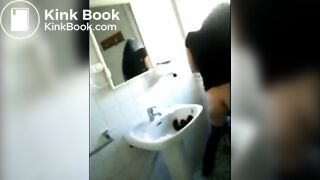 Woman shitting in the sink