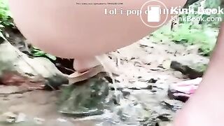 Asian Beauty - pooping in the river