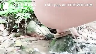 Asian Beauty - pooping in the river