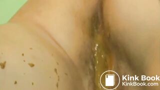 Lady covering her pussy in liquid shit