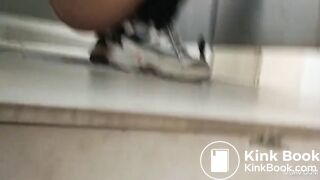 Asian restroom under stall spy