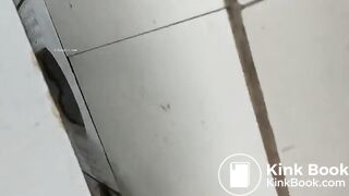 Asian restroom under stall spy