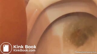 Amateur girl poops on the toilet from behind