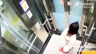 Asian woman shitting in an elevator