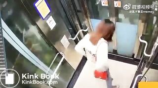 Asian woman shitting in an elevator