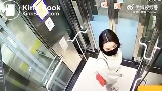 Asian woman shitting in an elevator