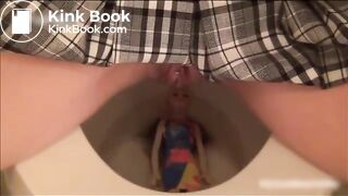 cute blonde schoolgirl shitting on a doll