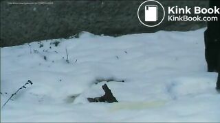 Relieving herself in the snow..