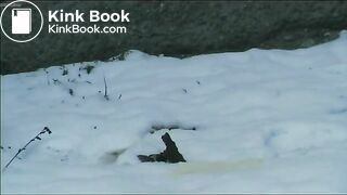 Relieving herself in the snow..