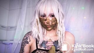 ... shitting and putting dildo in vagina