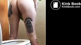 Tattooed girl pooping