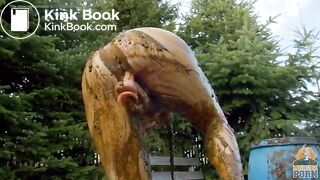 Busty babe masturbating in a bathtub full with cow shit