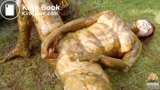 Busty babe masturbating in a bathtub full with cow shit