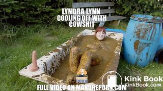 Busty babe masturbating in a bathtub full with cow shit