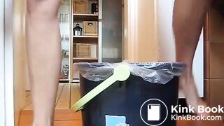 German lady defecates in a trash can..