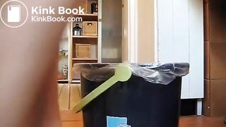 German lady defecates in a trash can..