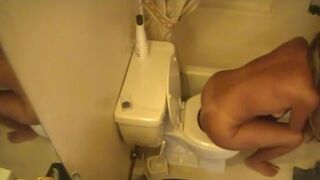 Tanned hot blonde girl shitting a lot on toilet