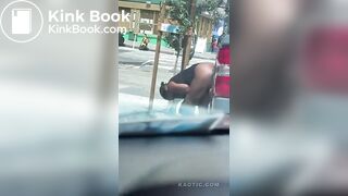 Woman shits on the street.