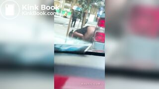Woman shits on the street.