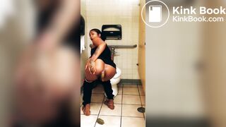 Black woman shitting on stall floor of public toilet - video 2