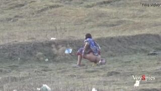 Desi bhabi pooping on open field