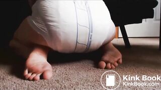 Releasing enema into diaper and showing the result