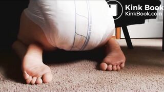 Releasing enema into diaper and showing the result