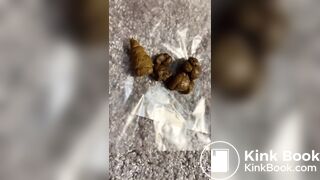 girl poops big on a carpet