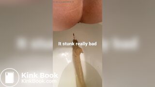young long turd toilet