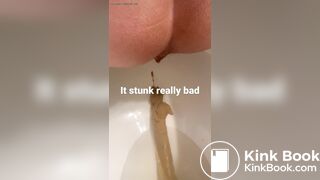 young long turd toilet