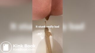 young long turd toilet