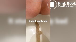 young long turd toilet
