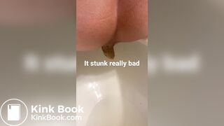 young long turd toilet