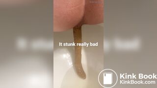 young long turd toilet