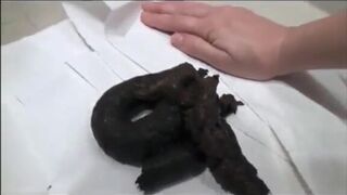 Sexy girl shits black colour poop
