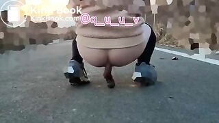 Japanese Twitter girl outside big long poop