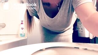 Hot girl films herself shitting on toilet