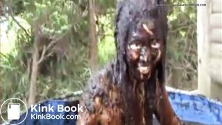 Thai girl taking a bath in cow shit.