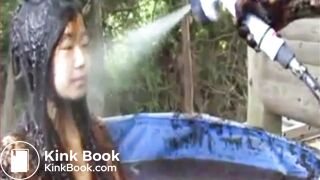 Thai girl taking a bath in cow shit.