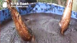 Thai girl taking a bath in cow shit.