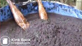 Thai girl taking a bath in cow shit.