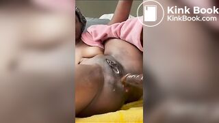 Ebony puts dildo in her ass