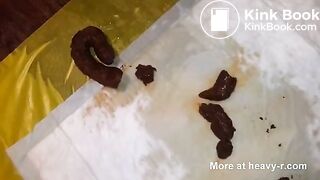 Sucking and licking her own big turd