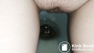 Showing hairy pussy while shitting