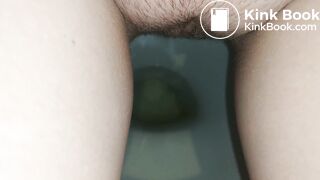 Showing hairy pussy while shitting